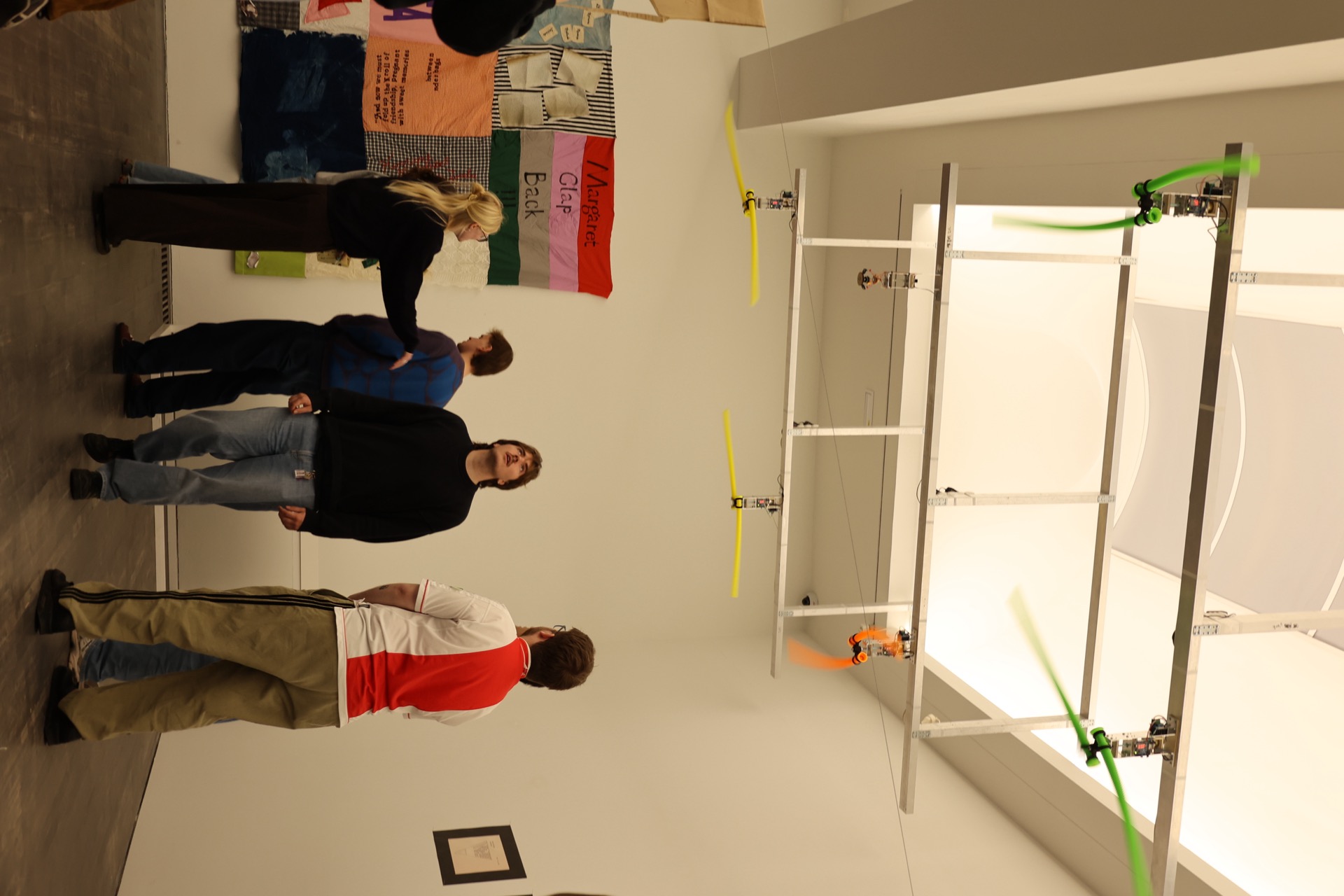 Audience looking up at the tube installation